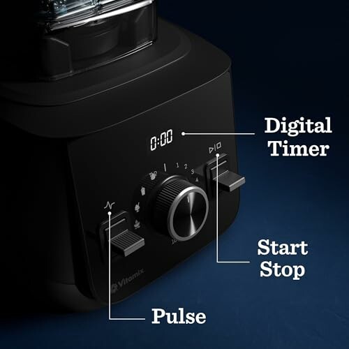 Close-up of a blender control panel with digital timer, start stop, and pulse buttons.