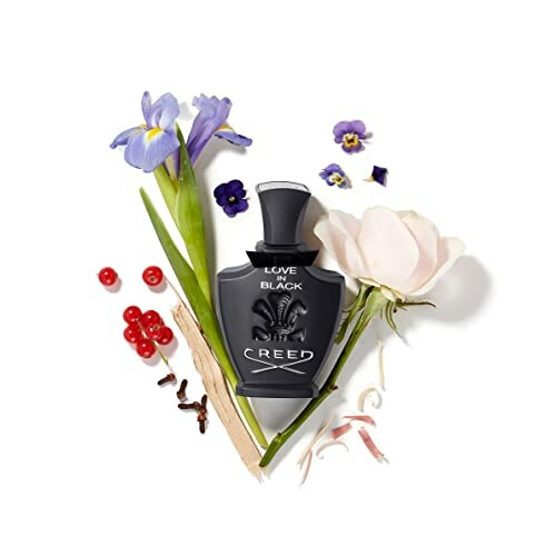 Creed Love in Black perfume bottle with flowers and berries