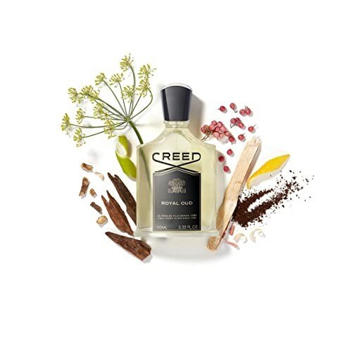Creed Royal Oud fragrance bottle surrounded by natural ingredients