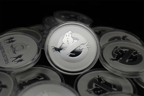 Commemorative coins featuring Ghostbusters logo.