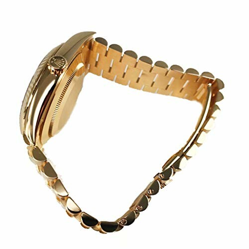 Side view of a gold watch with a linked strap.