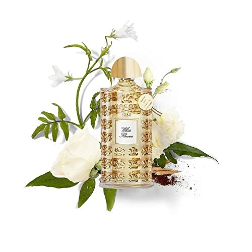 Elegant gold perfume bottle with white flowers and greenery