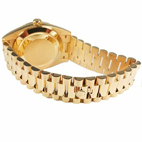 Back view of a luxury gold watch with a metal bracelet.