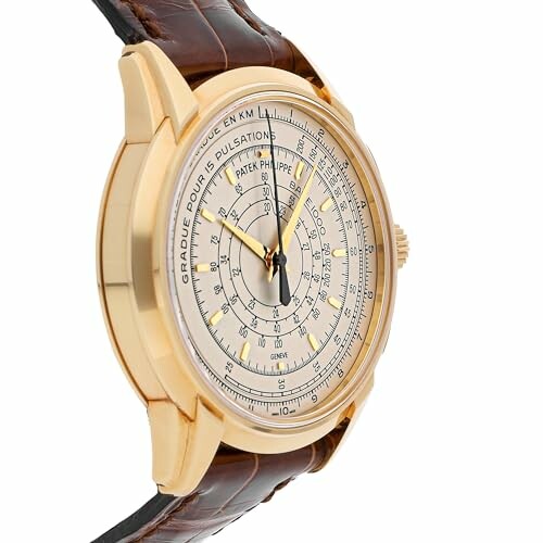 Luxury gold watch with leather strap and detailed dial.