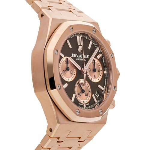 Luxury gold watch with black face and chronograph features