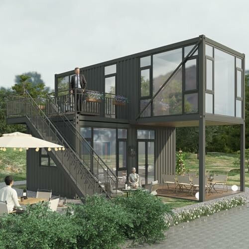 Two-story modern container house with outdoor seating.
