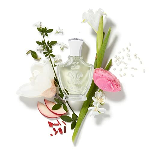 Perfume bottle surrounded by flowers and petals