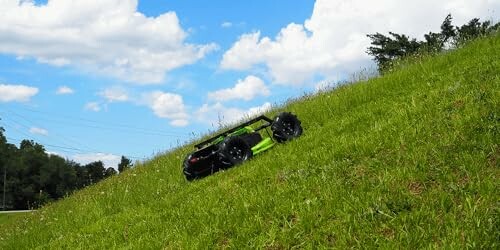 Robot mower climbing a grassy hill