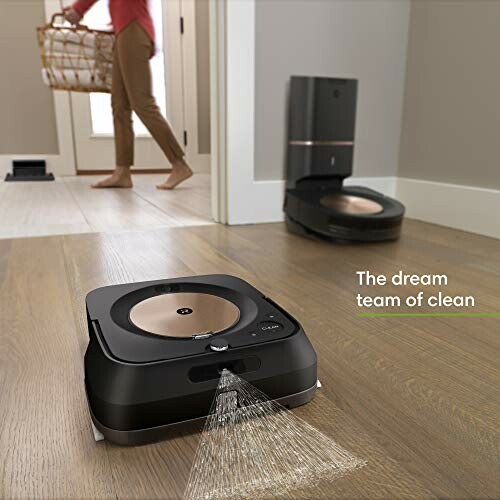 Robot vacuum and mop cleaning a wooden floor with a person in the background.