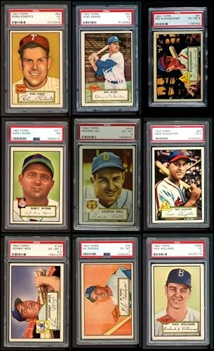 Collection of vintage baseball cards in protective sleeves.